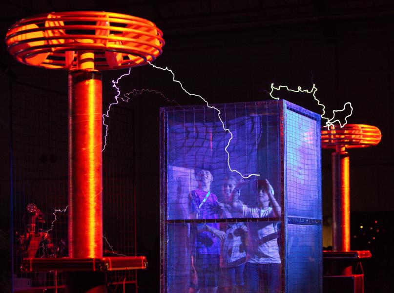 Kids survive in The Cage at the Tesla Stage, San Mateo Maker Faire