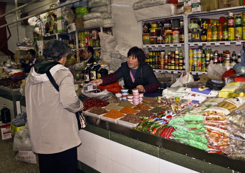 Vendor Bartering with Tourist- China