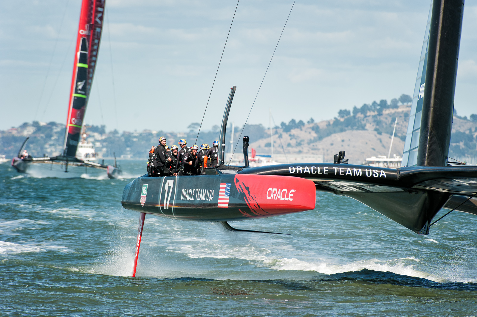 Oracle USA boat crosses the finish line ahead of New Zealand to win the final America's Cup race