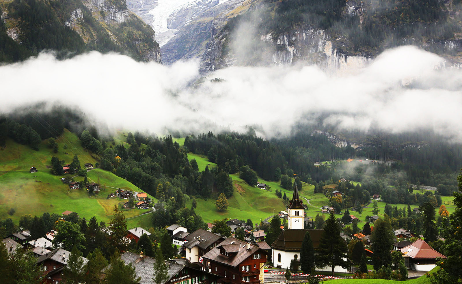 A Switzerland village in a foggy morning