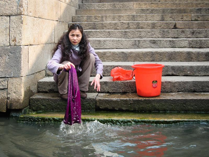 Washing Laundry in Canal in Suzhou, China