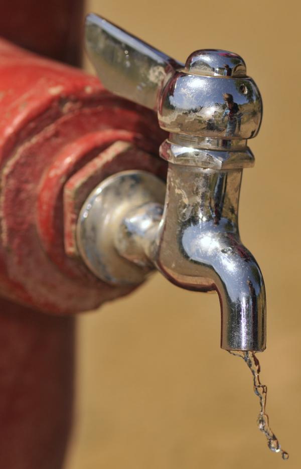 Boy and Water Spigot