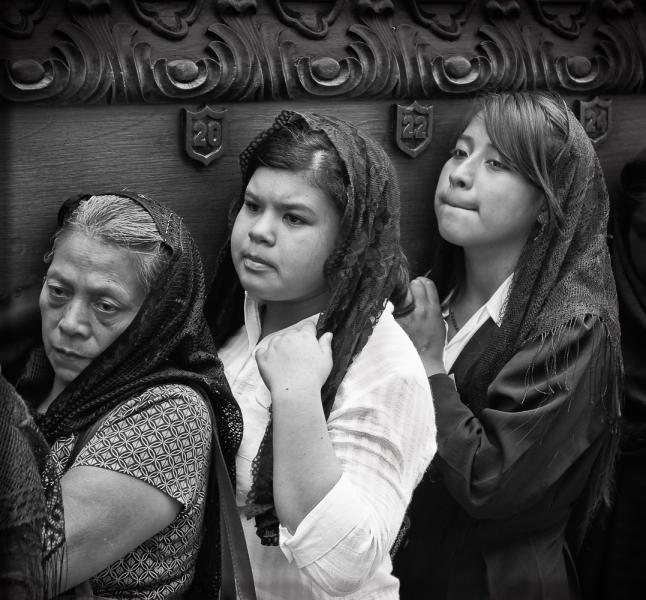 Female Participants Lifting The Symbolic Coffin of Jesus During Semana Santa, Antigua, Guatemala