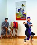 Okinawan dancer throws a karate punch to the accompaniment of drums at the Japanese Cultural Day in Cupertino, CA