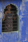 Young Girl Looking Thru Her Window