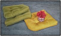 Flower Vase Resting with Colored Pillows
