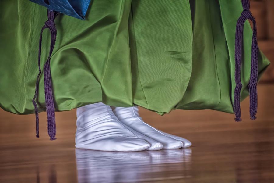 Wearing traditional Japanese tabi socks and robe.
