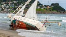 A sailboat run aground at Pacifica State Beach attracts the curious, April 29, 2018