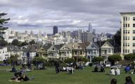 Iconic San Francisco Views from Alamo Square Park. Old and new-Victorian Homes from the 1890's and 2018 skyline with Transamerica Pyramid, Bank of America Building and new Salesforce Tower