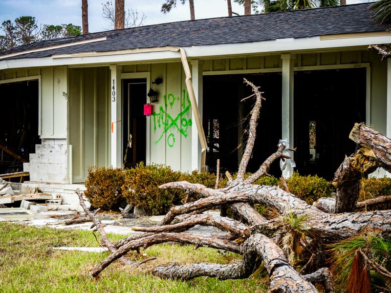 House damaged by Hurricane Michael shows a search and rescue X, the left side shows the search team ID, the top shows the date searched, the right shows hazards, and the bottom shows casualties found.