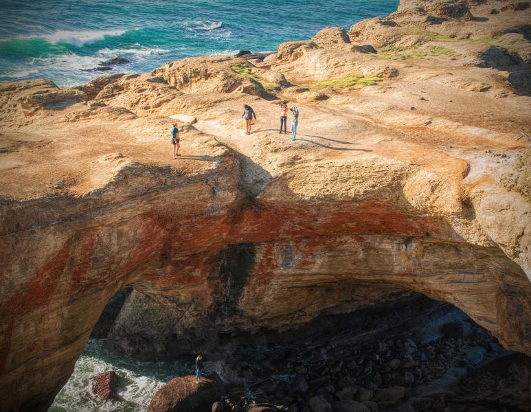 Exploring Devils Punch Bowl, Oregon Coast.
