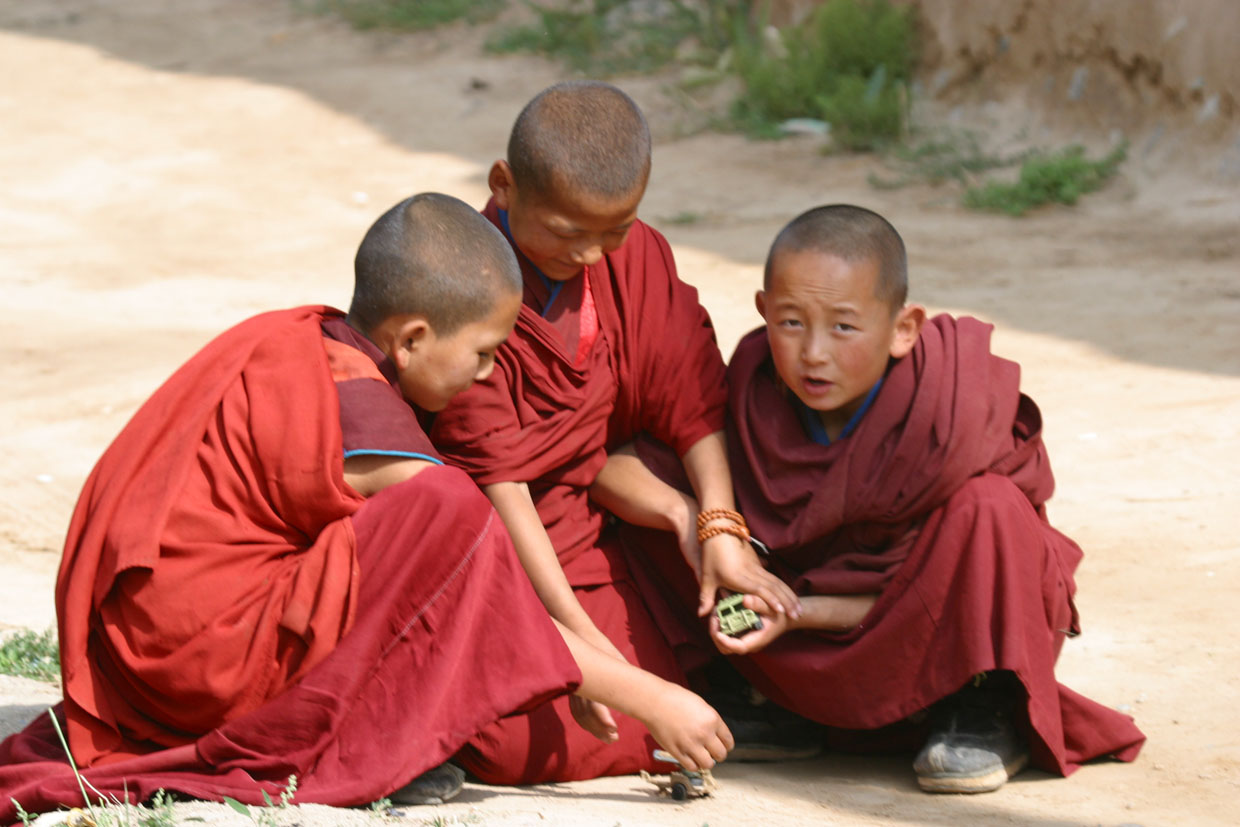 Baby monks are also kids. They like toys too.