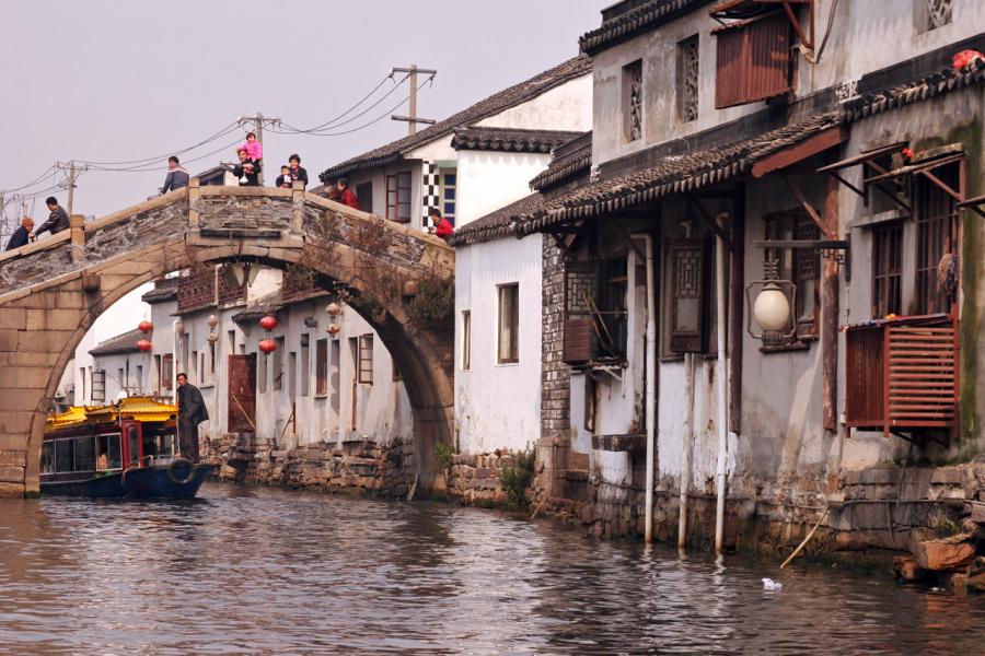 Cruising Under Bridge on Szuchou Canal, China