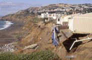 Deck Falls Off House as Erosion Takes Earth Away